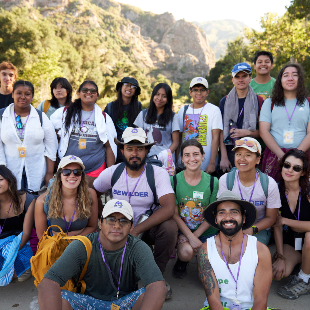 LA River Fellows pose in front of greenery on a sunny day.