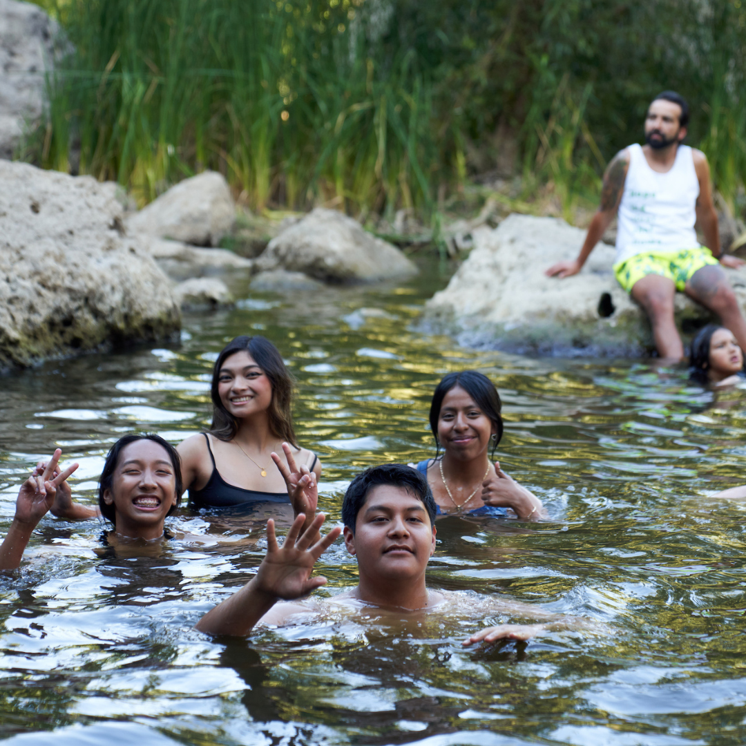 LA River Fellows pose while swimming in the river.