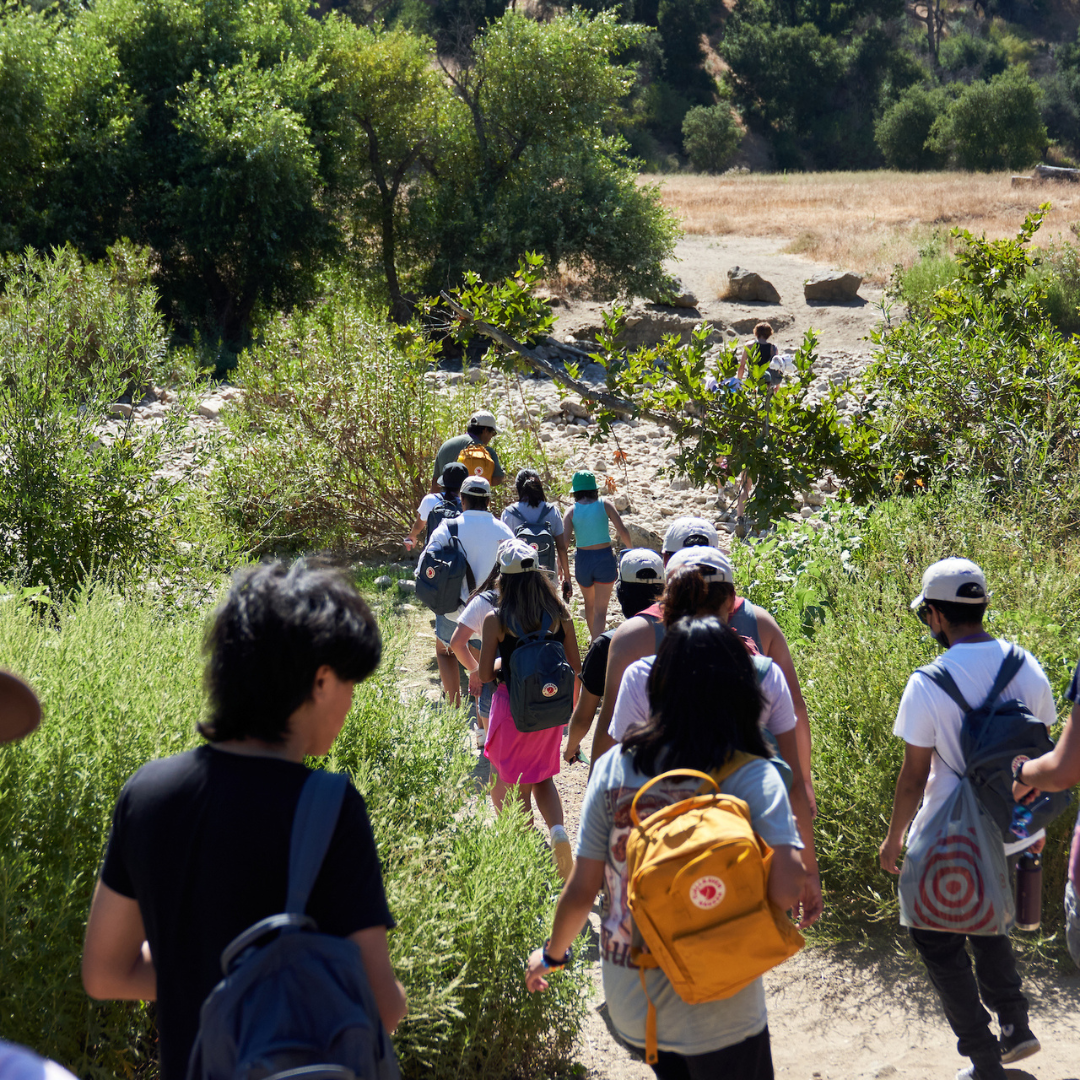 LA River Fellows walking a trail on a sunny day.